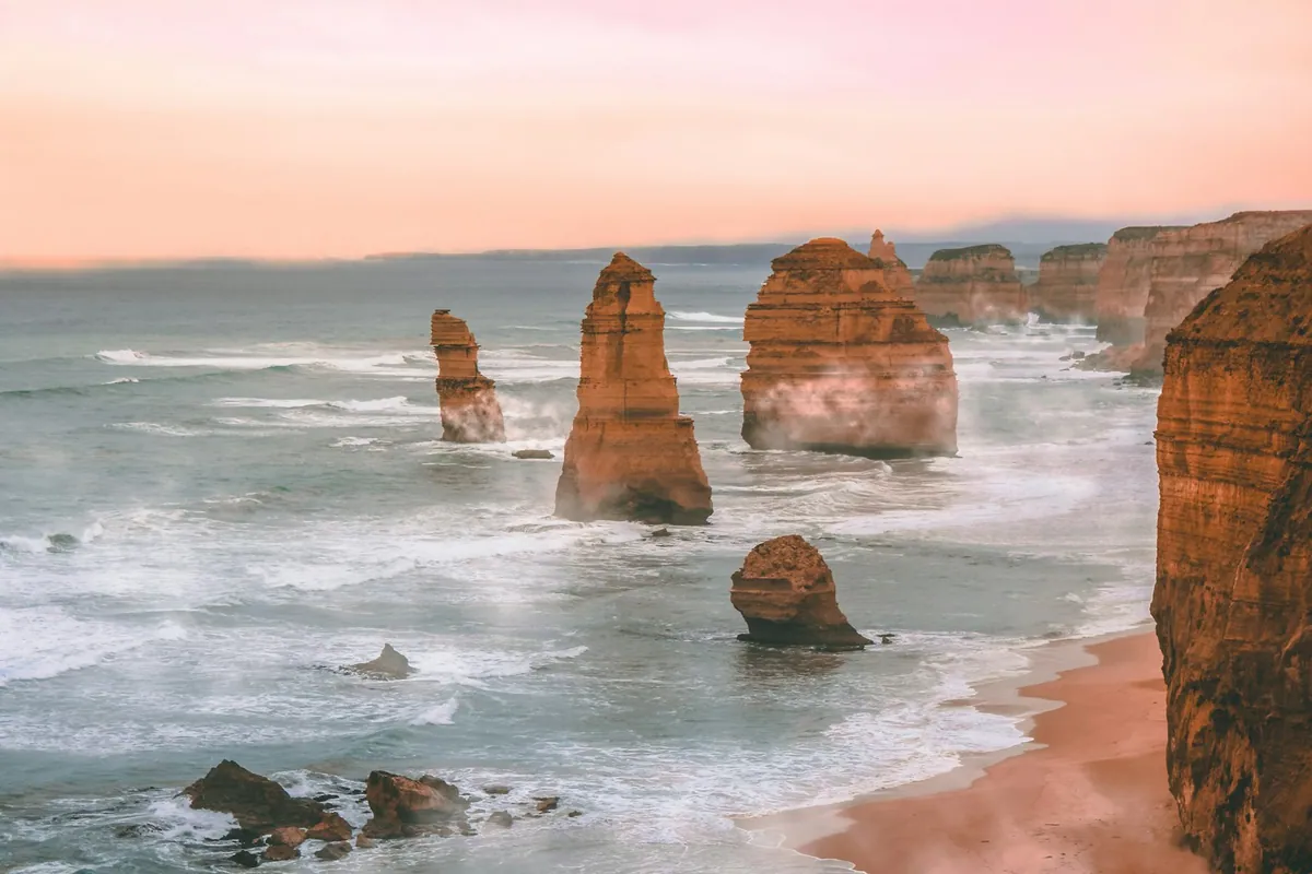 Twelve Apostles rock formations rising from the surf at Princetown, Great Ocean Road