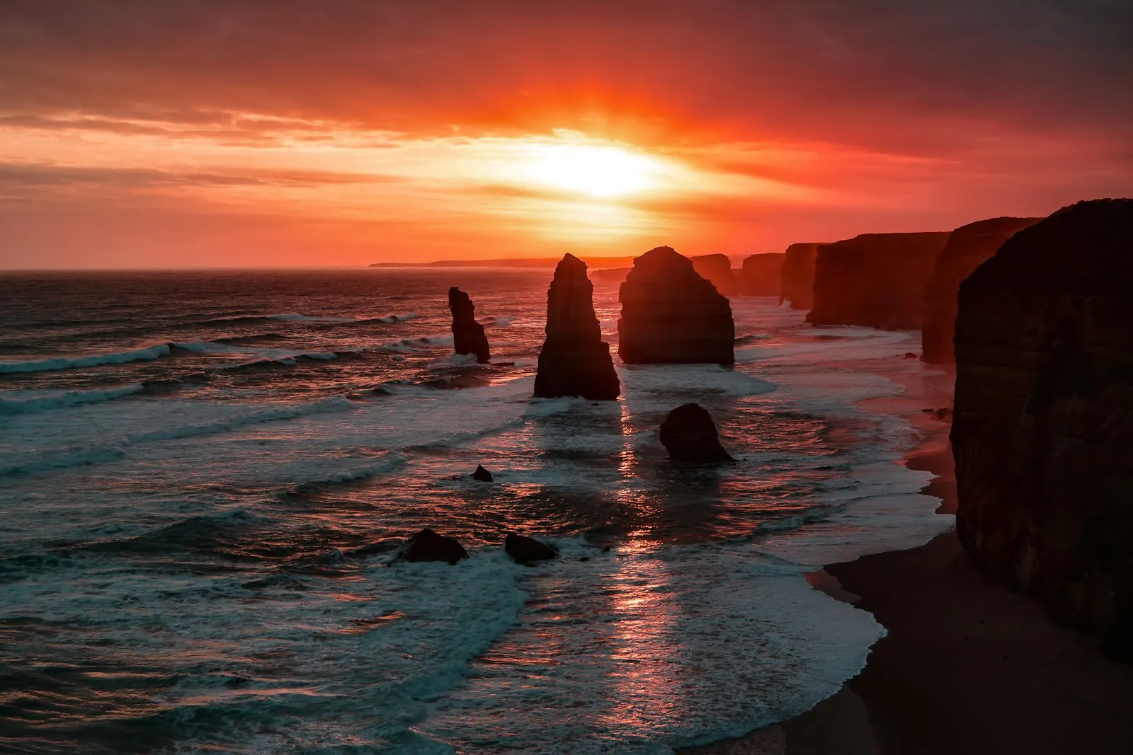 Twelve Apostles sea stacks rising from the Southern Ocean at golden hour, Great Ocean Road