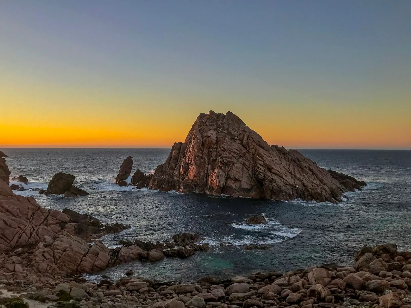 Sunset over Sugarloaf Rock on the Cape Naturaliste coastline near Margaret River, Western Australia