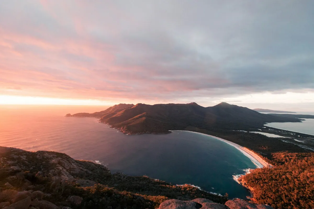 Sunrise over Wineglass Bay seen from the lookout in Freycinet National Park, Tasmania
