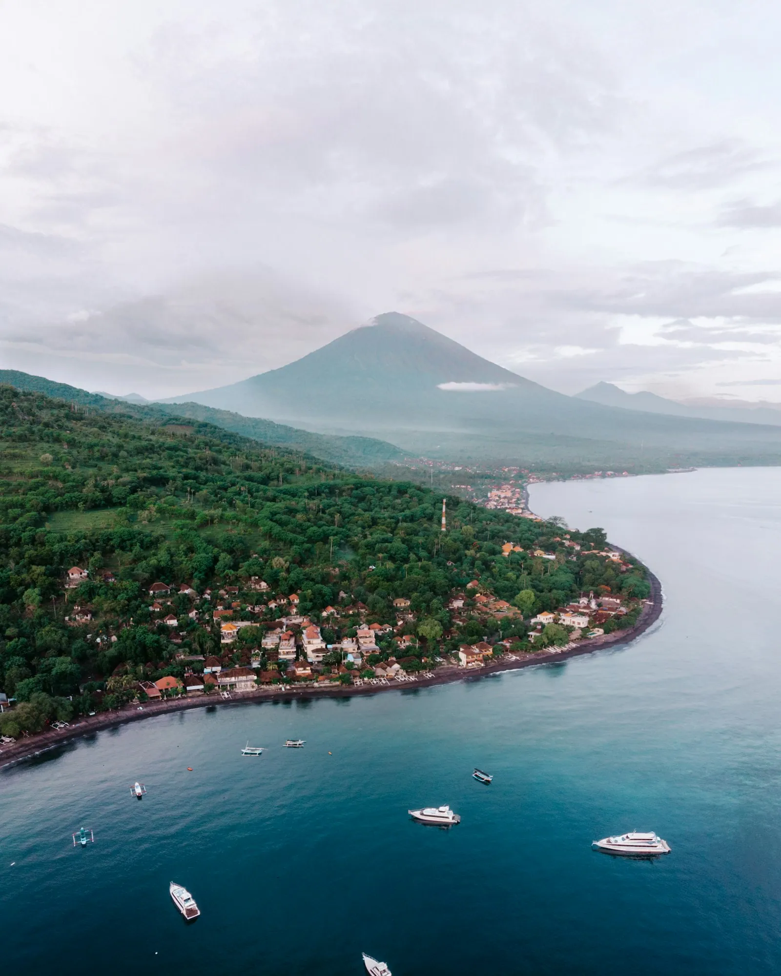 Traditional jukung outrigger boats floating off Amed Beach in east Bali