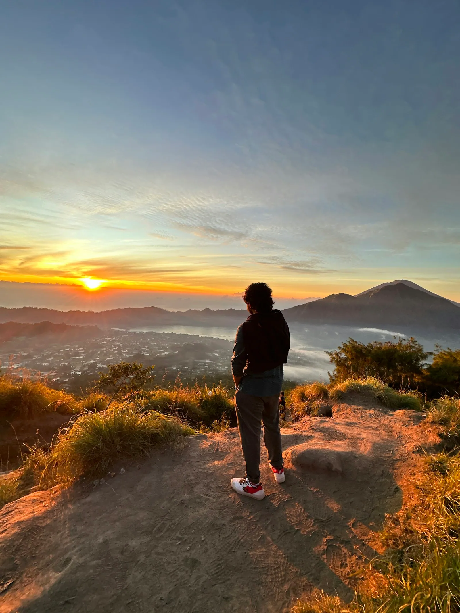 Hiker at the Mount Batur sunrise viewpoint in Kintamani, Bali