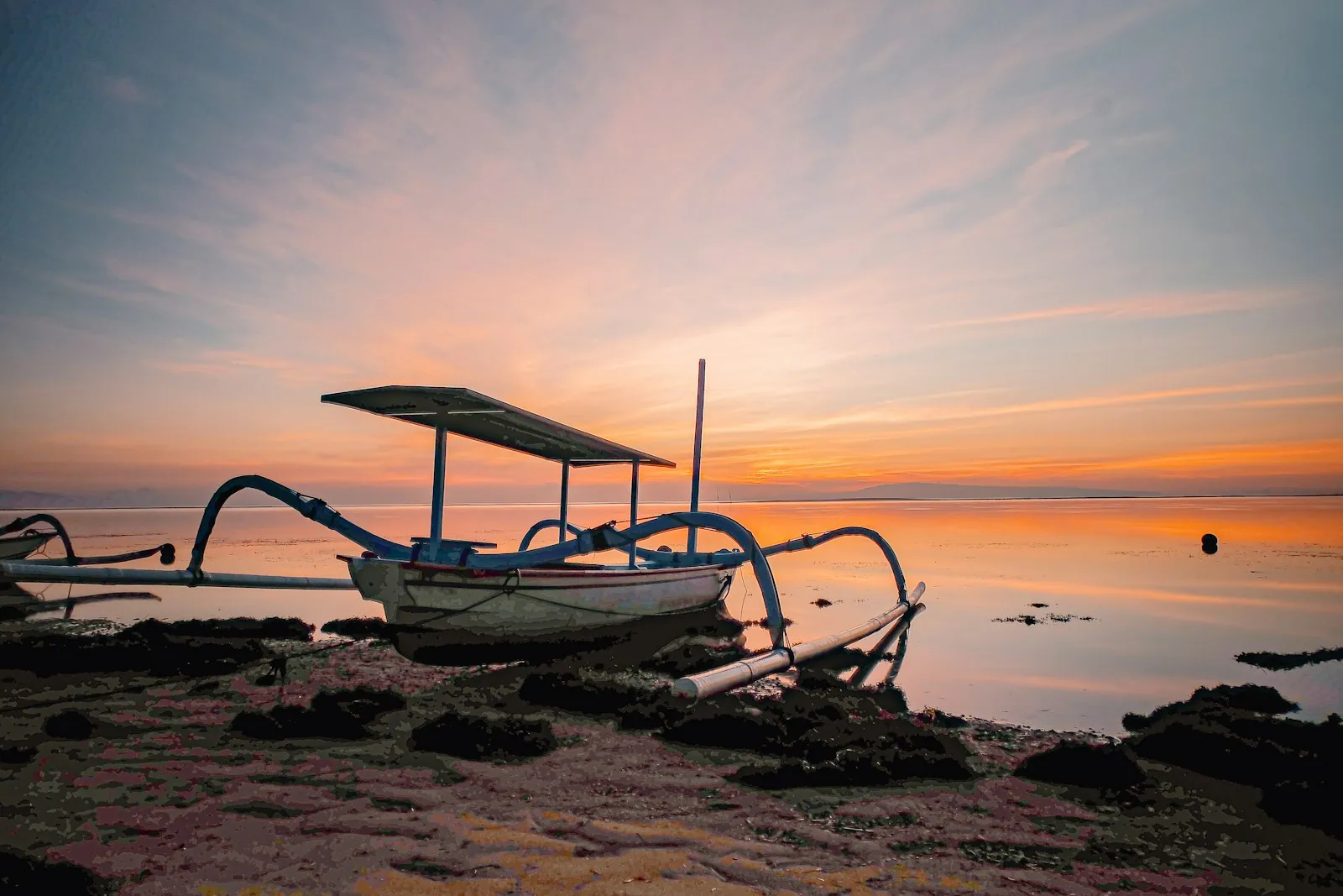 Traditional jukung boat on Sanur Beach in the morning, Bali