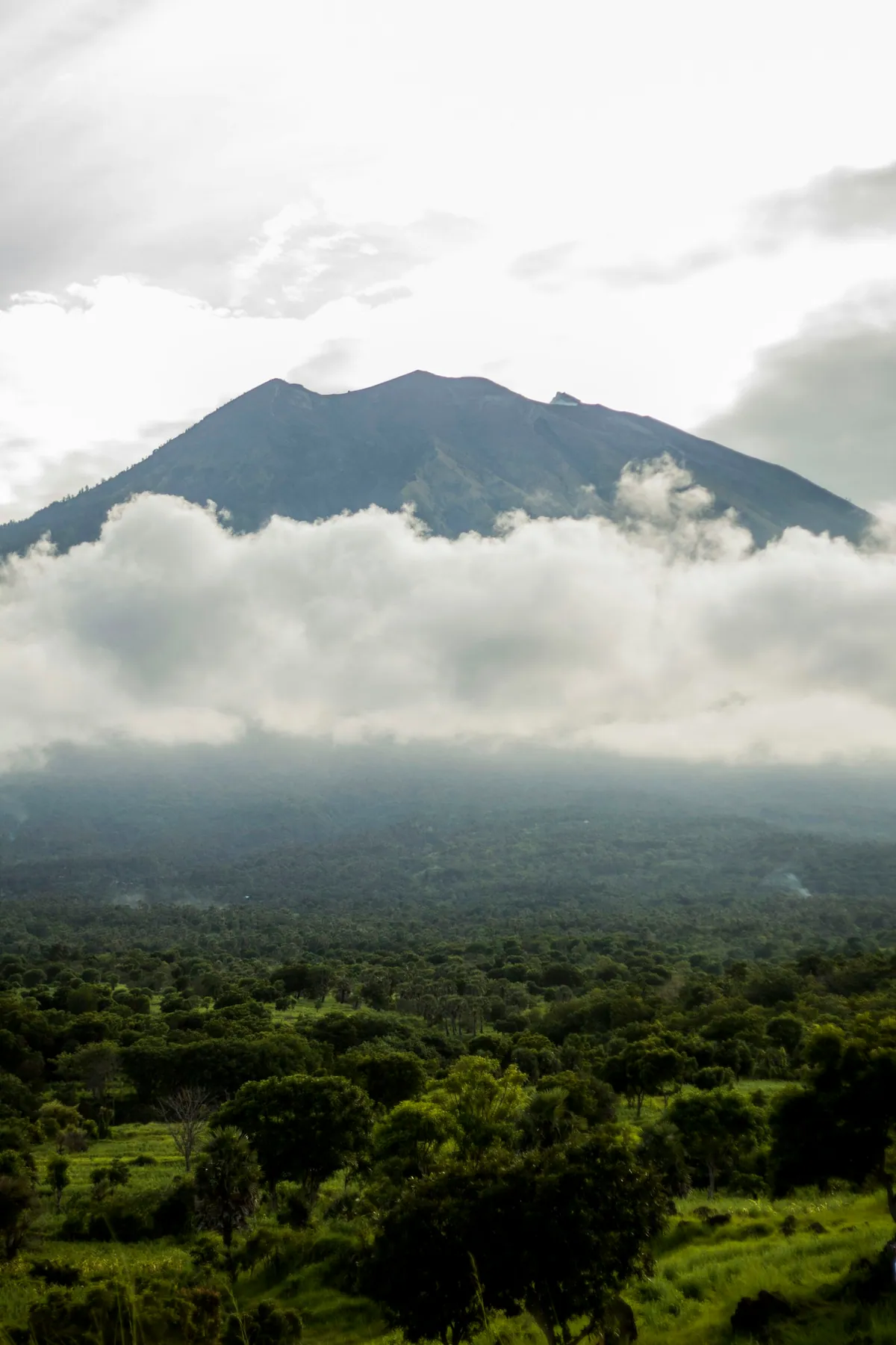 Mt Agung silhouetted at sunrise over the eastern Bali landscape