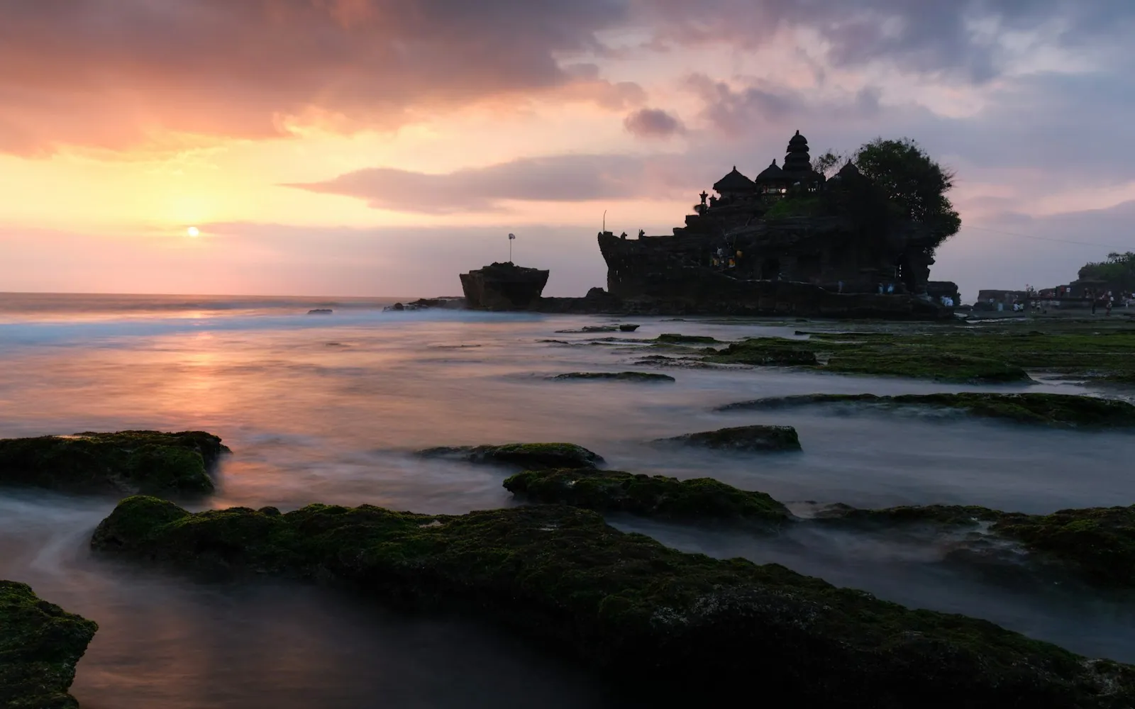 Pura Tanah Lot sea temple on its rocky outcrop at sunset, Bali