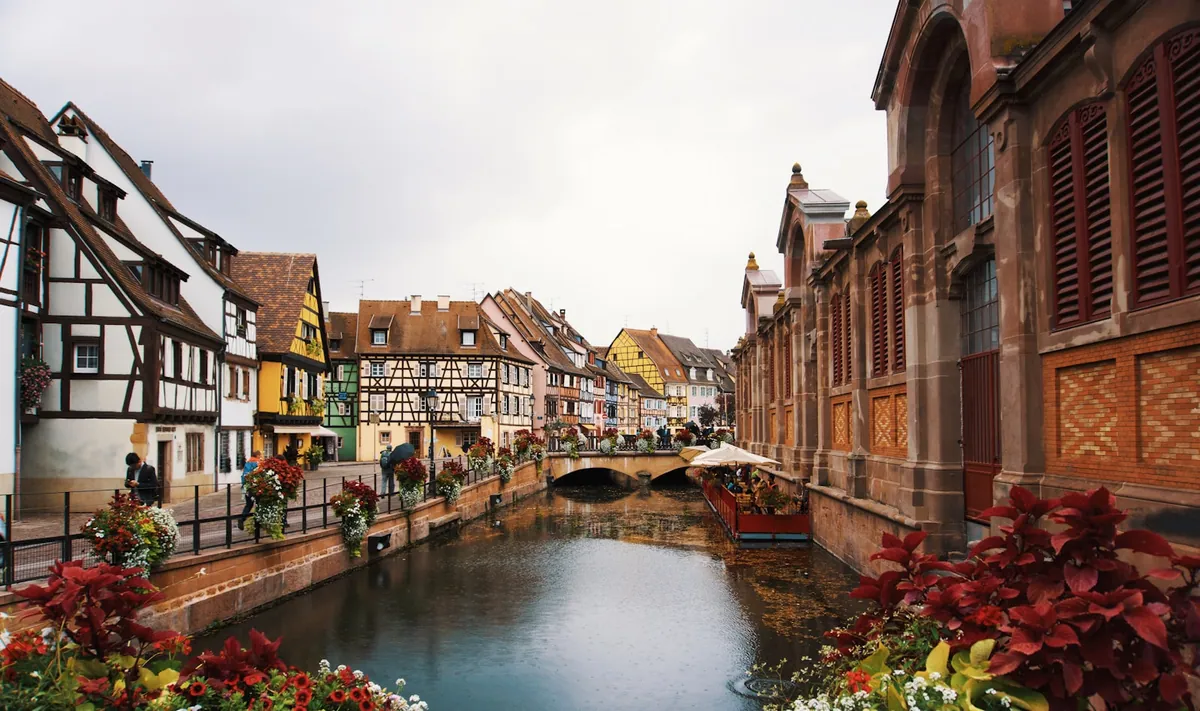 Half-timbered houses with flower boxes along Colmar’s canal