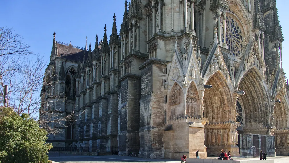 Side view of the Cathedrale Notre-Dame de Reims by day
