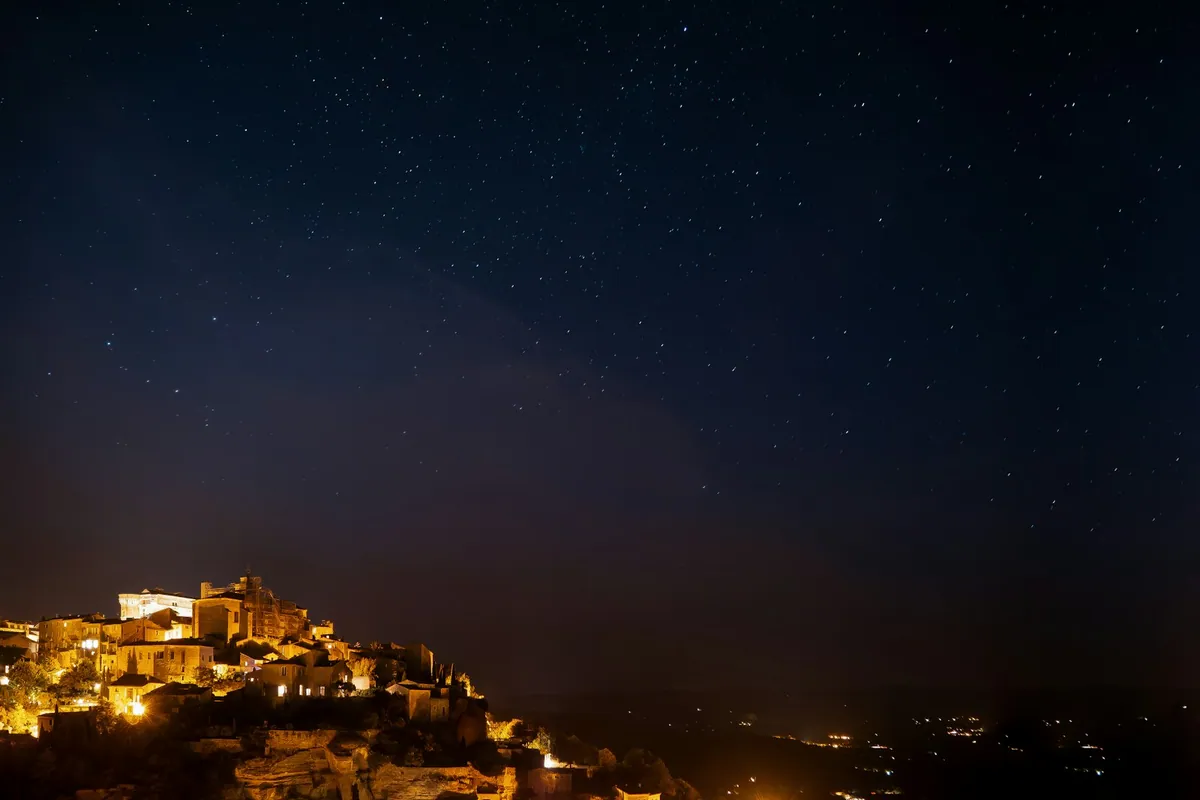 Hilltop village of Gordes lit at night, Provence
