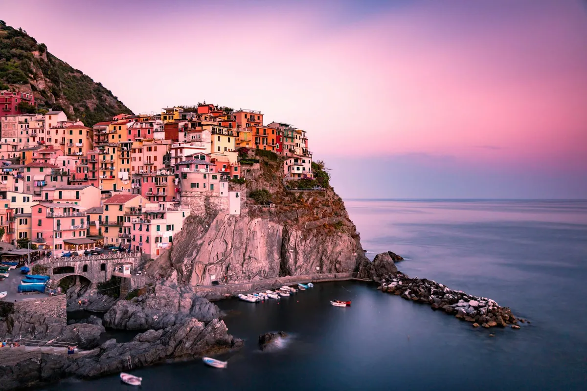 Manarola village in Cinque Terre at sunset with long exposure