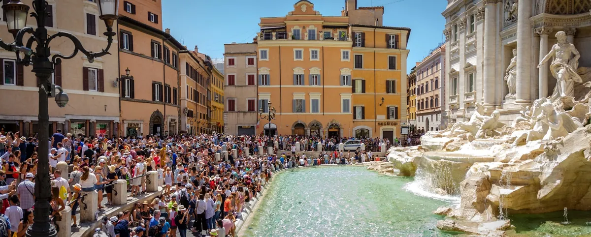 Crowd gathered in front of the Trevi Fountain in Rome