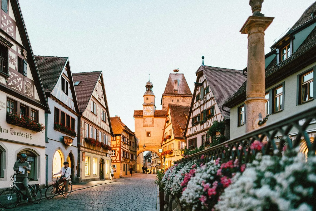 Italian piazza with cobblestones cathedral and outdoor cafe tables in northern Italy