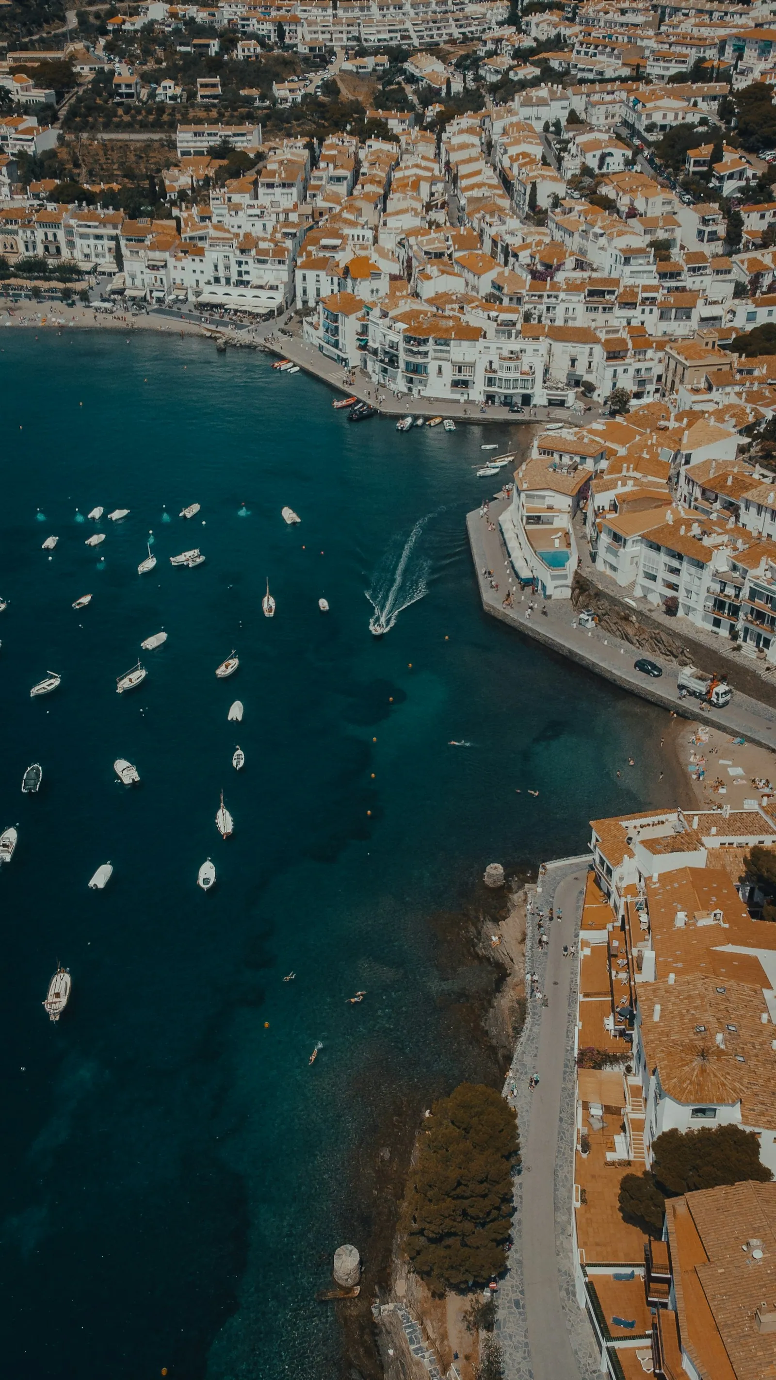 Aerial view of Cadaques whitewashed village by the sea, Costa Brava