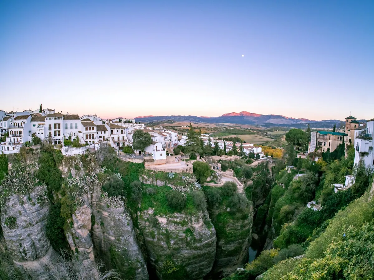 White houses of Ronda above the valley at sunset, Andalucia